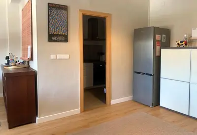 a kitchen with a refrigerator and a sink and a mirror at KOA Centric, comfy in Ruzafa in Valencia