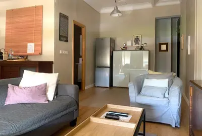 a living room with a couch and a chair at KOA Centric, comfy in Ruzafa in Valencia