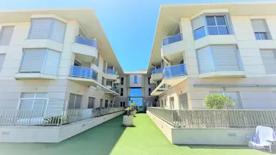 a view of two apartment buildings with green grass at BEACH VALENCIA LUXURY A40-35 Apartment with terrace and sea views in Valencia