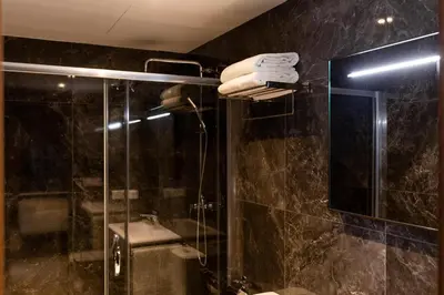 a bathroom with a shower and a glass shower stall at Ramirez Flats Valencia in Valencia