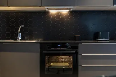 a kitchen with a sink and an oven with a counter at Ramirez Flats Valencia in Valencia
