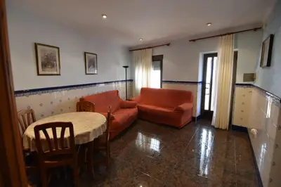 a living room with a couch and a table at La Muralla Del Castillo in Chulilla