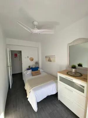 a bedroom with a bed and a ceiling fan at Beach Malvarrosa, Cabañal, Wifi free. Ca' Micaela. in Valencia