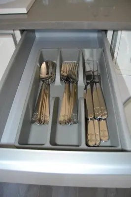 a tray of silver utensils in a drawer at Beach Malvarrosa, Cabañal, Wifi free. Ca' Micaela. in Valencia
