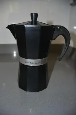 a black coffee pot sitting on a counter at Beach Malvarrosa, Cabañal, Wifi free. Ca' Micaela. in Valencia