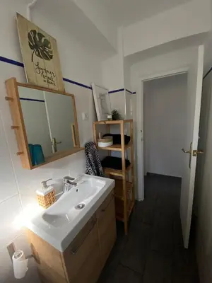 a bathroom with a sink and a mirror at Beach Malvarrosa, Cabañal, Wifi free. Ca' Micaela. in Valencia