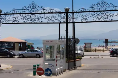 a phone booth in a parking lot next to the ocean at Cap Blanc Penthouse in Cullera