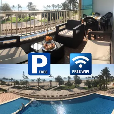 a collage of two pictures of a resort with the p free wifi logo at Apartamento en la playa Arensol Cullera in Cullera