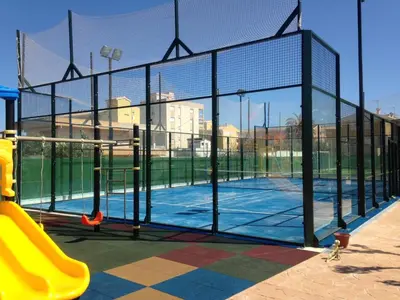 a batting cage on a tennis court at Camping y Bungalows Monmar in Moncófar