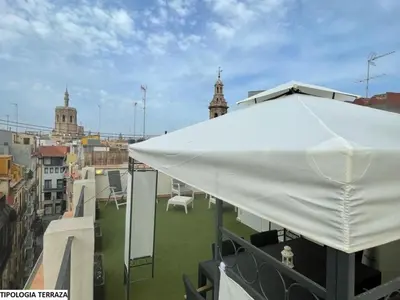 a white tent on the roof of a building at Valentia Apartments - Mercado Central in Valencia