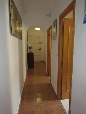 a hallway with a hallway leading to a room at Apartamento Playa Malvarrosa, Valencia in Valencia