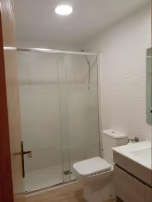 a bathroom with a shower with a toilet and a sink at Apartamentos Satse Moncofa in Moncófar