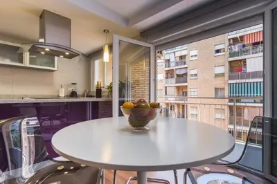 a kitchen with a table with a bowl of fruit on it at Cedro flat in Valencia