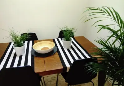 a wooden table with plants and a bowl on it at Apartamento céntrico Torres de Quart. in Valencia