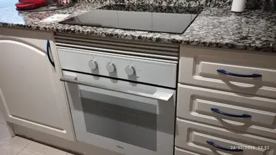 a kitchen with a stove and a sink at Apartamento céntrico Torres de Quart. in Valencia