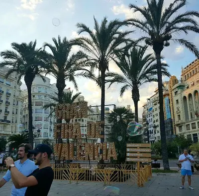 a group of men standing in front of a display with palm trees at Bianca in Valencia