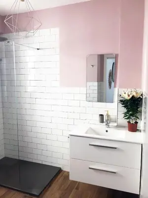 a white bathroom with a sink and a shower at Goya atico in Valencia