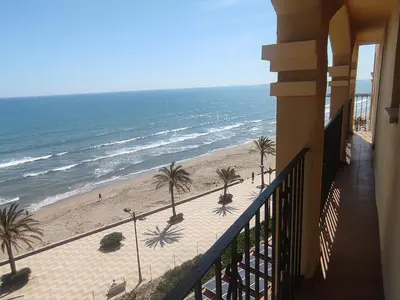 a balcony with a view of the beach at ValenciaBeachHome in Port Saplaya