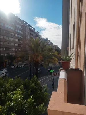 a view from a balcony of a city street with buildings at Habitaciones Centricas en una casa Valenciana in Valencia