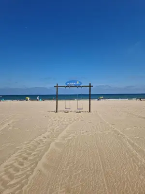 a life guard stand on a sandy beach at Apartamento Barbacoa, Piscina y playa in Puebla de Farnals