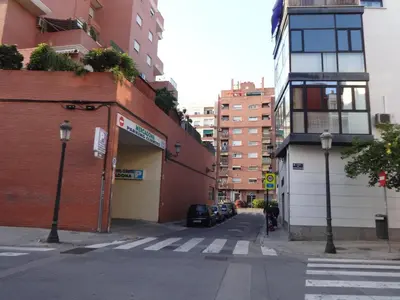a city street with a building and a car parked on the street at Apartamento Romántico in Valencia