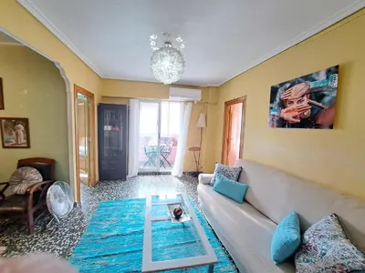 a living room with a couch and a table at Full equipped and comfortable apartment with WiFi in Valencia