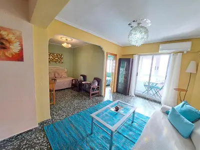a living room with a couch and a table at Full equipped and comfortable apartment with WiFi in Valencia