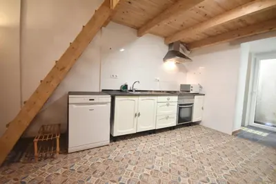 a kitchen with white cabinets and a sink at Apartamento cerca de la playa in Valencia