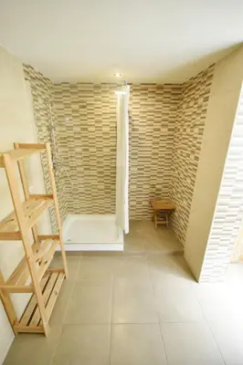a room with a wooden ladder and a brick wall at Apartamento en casa historica en la playa in Valencia
