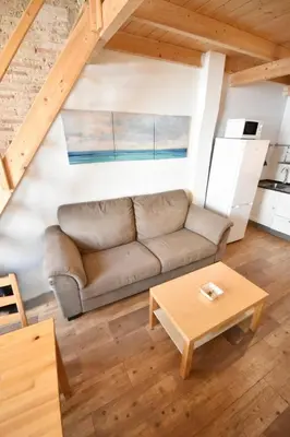 a living room with a couch and a table at Apartamento en casa historica en la playa in Valencia