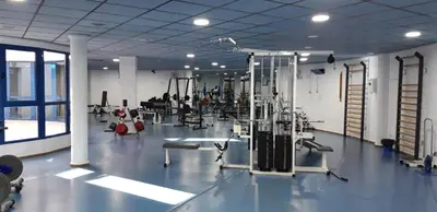 a gym with machines and equipment in a room at PATACONA MARE NOSTRUM APARTMENT in Valencia