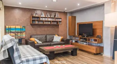a living room with a couch and a tv at AA la Nueva Fe in Valencia