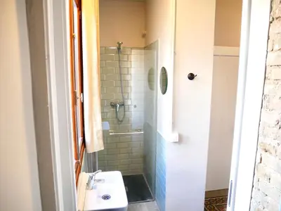 a bathroom with a shower and a sink at Bird House in Valencia