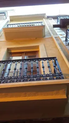 a balcony on a building with a window at PLAZA REDONDA brugada home in Valencia