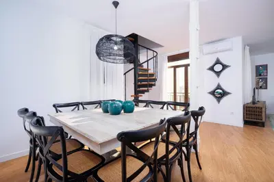 a dining room with a table and chairs at Valencia Luxury - Boutique Market in Valencia