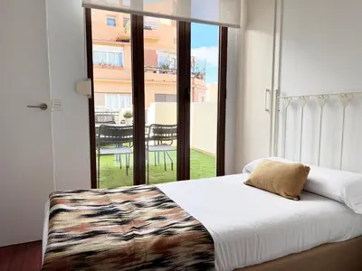 a bedroom with a bed and a large window at Valencia Luxury - Boutique Market in Valencia