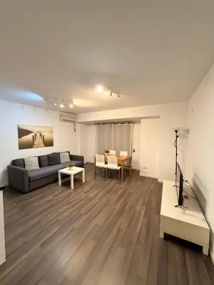 a living room with a couch and a table at Zerka Centro in Valencia