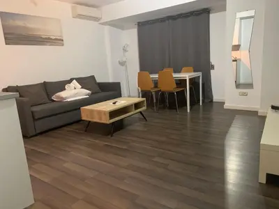 a living room with a couch and a table at Zerka Centro in Valencia