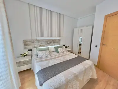 a bedroom with a large bed and a window at Cozy apartment in Valencia! WI-FI ! in Valencia
