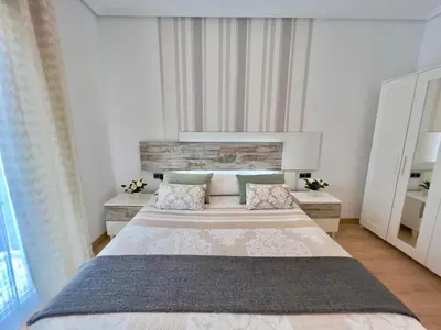 a bedroom with a large bed with two pillows at Cozy apartment in Valencia! WI-FI ! in Valencia