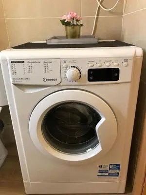 a washing machine with a plant on top of it at Cozy apartment in Valencia! WI-FI ! in Valencia