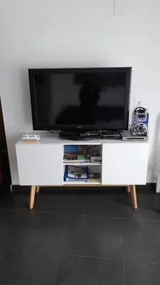 a flat screen tv on a white entertainment center at Casa rural La Senyora in Veo