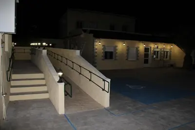 a staircase leading to a building at night at Casa Robion in Godelleta
