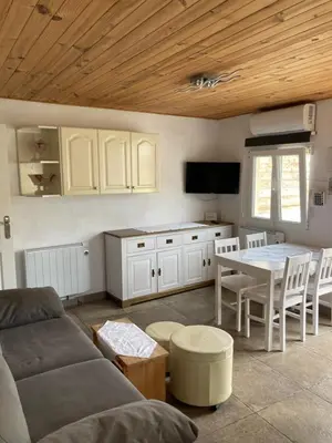 a living room with a couch and a table at Casa Robion in Godelleta