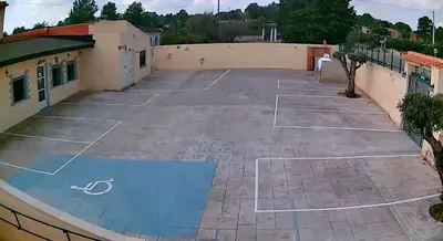 an empty parking lot with a basketball court at Casa Robion in Godelleta