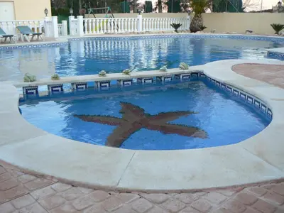 a swimming pool with a star in the middle at Casa Robion in Godelleta