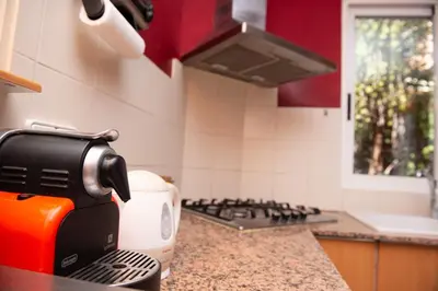 a kitchen with a coffee maker on a counter at Villa Rive Rouge in Riba-Roja De Turia