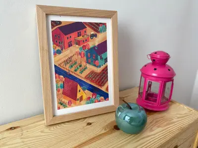 a picture frame sitting on a table next to a lamp and an apple at BEACH & SUN MONCOFA in Moncófar