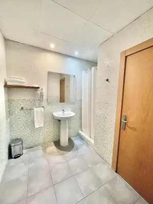 a bathroom with a sink and a mirror at Casual Civilizaciones Valencia in Valencia