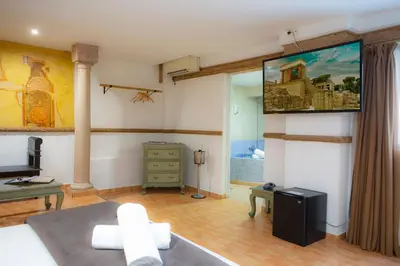 a living room with a large painting on the wall at Casual Civilizaciones Valencia in Valencia